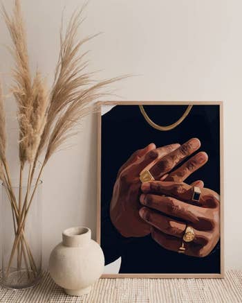 another framed print of a person wearing gold jewelry