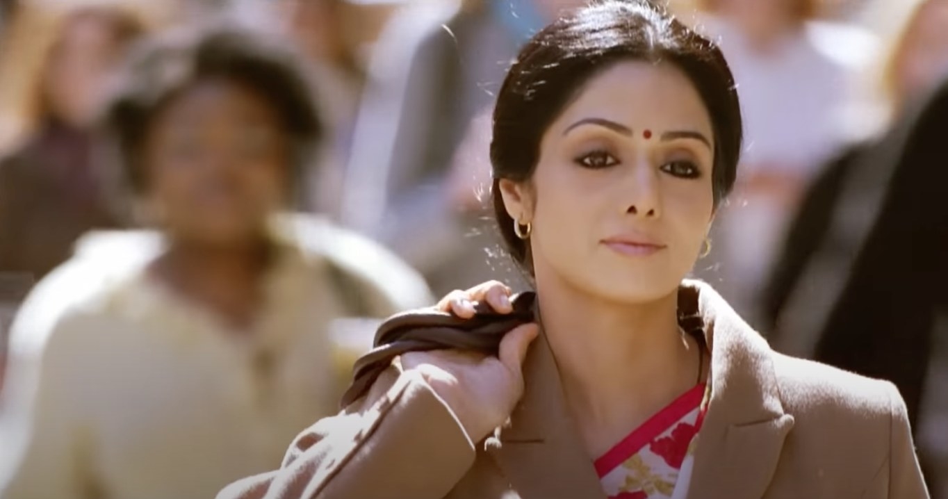 Sridevi walks on the street with a purse behind her back