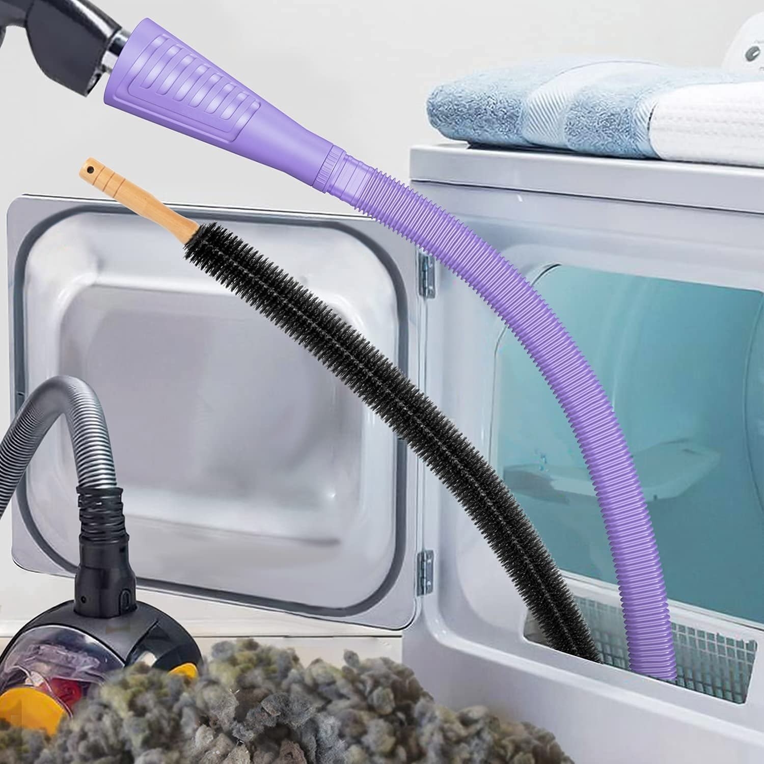 The purple dryer vent cleaning kit being used with a vacuum