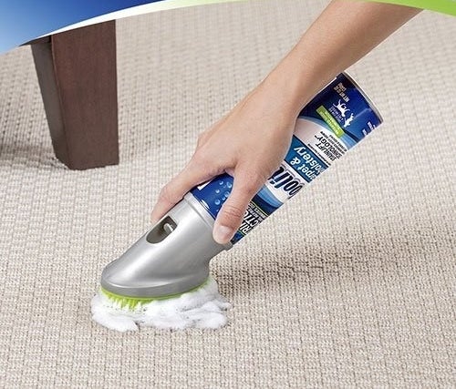 model using the cleaner on a carpet