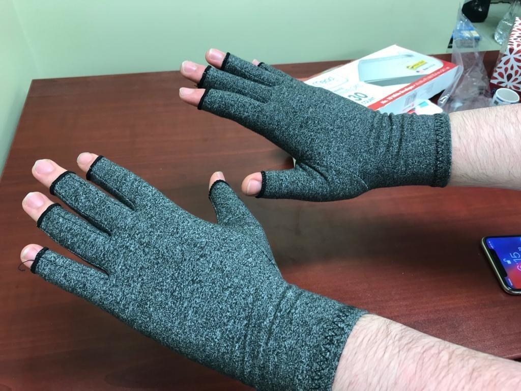 Reviewer&#x27;s photo of them wearing the compression gloves