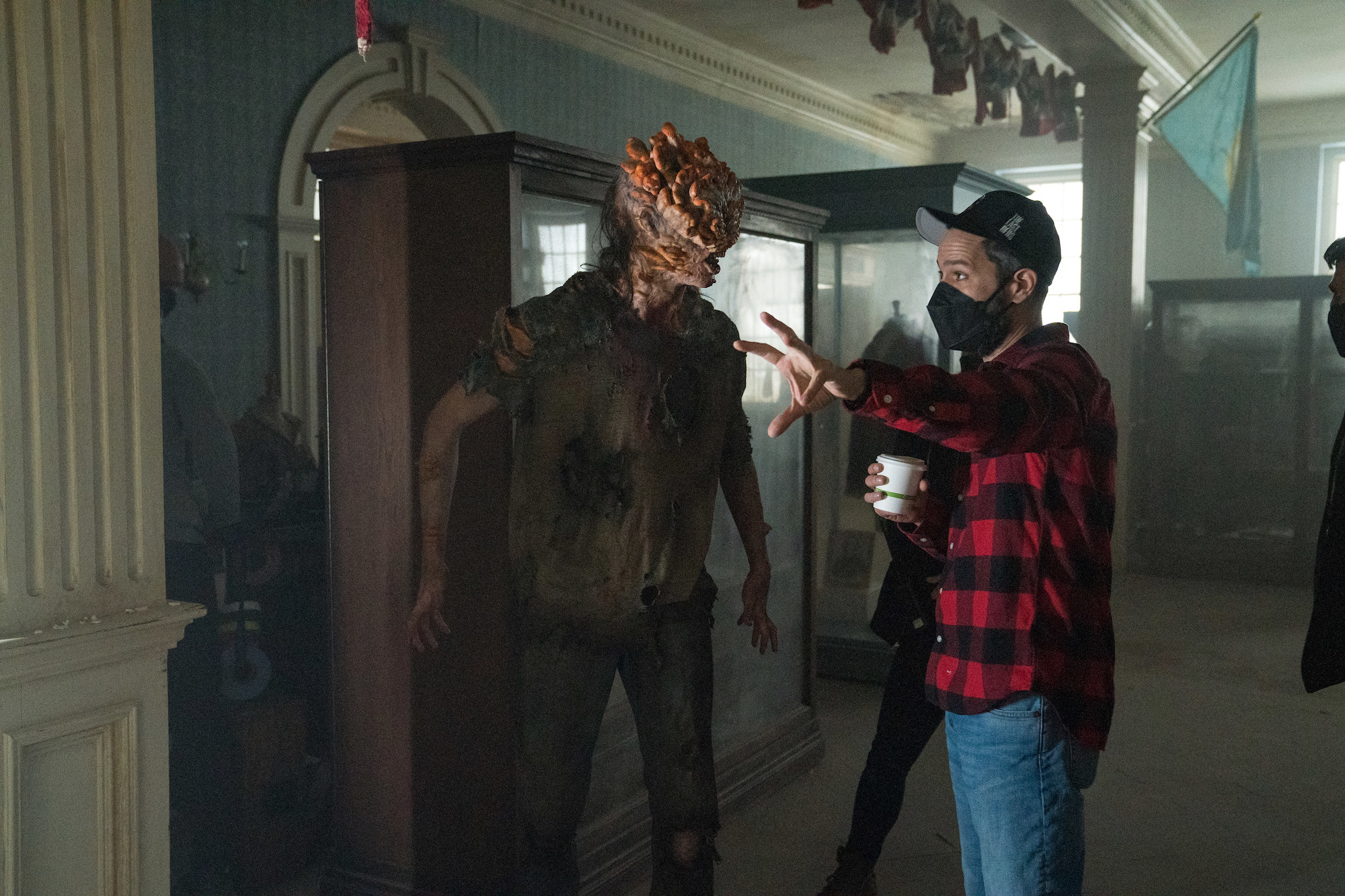 Samuel Hoeksema wears protheics to apear like an infected character in the show as the showrunner instructs him.