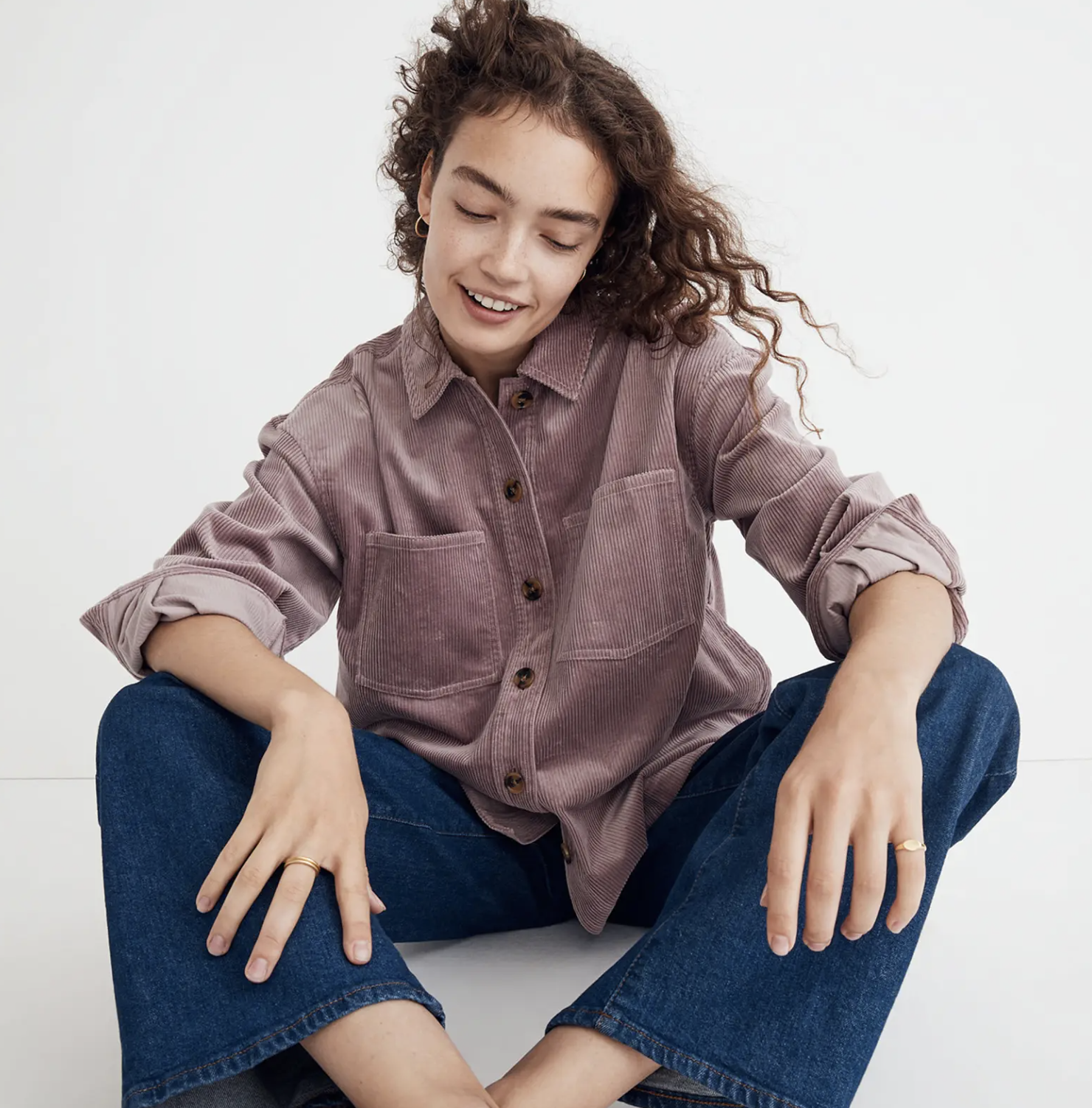 A person wearing the top with jeans