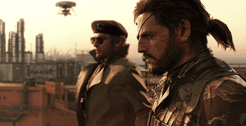 Snake standing next to Miller on the deck of Outer Heaven in Metal Gear Solid V