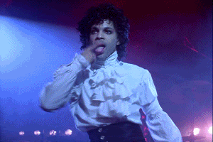 Prince in a frilly top dancing
