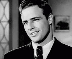 GIF of Brando smiling seductively