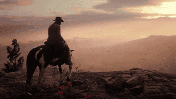 Arthur from Red Dead Redemption 2 sitting on his horse at a cliffside at sunset