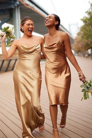Two models wearing beige cowl neck dresses in midi and maxi lenghts