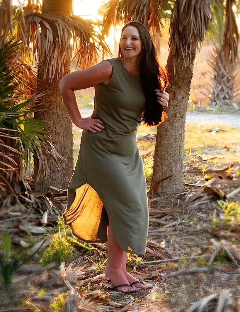 Reviewer wearing the olive dress