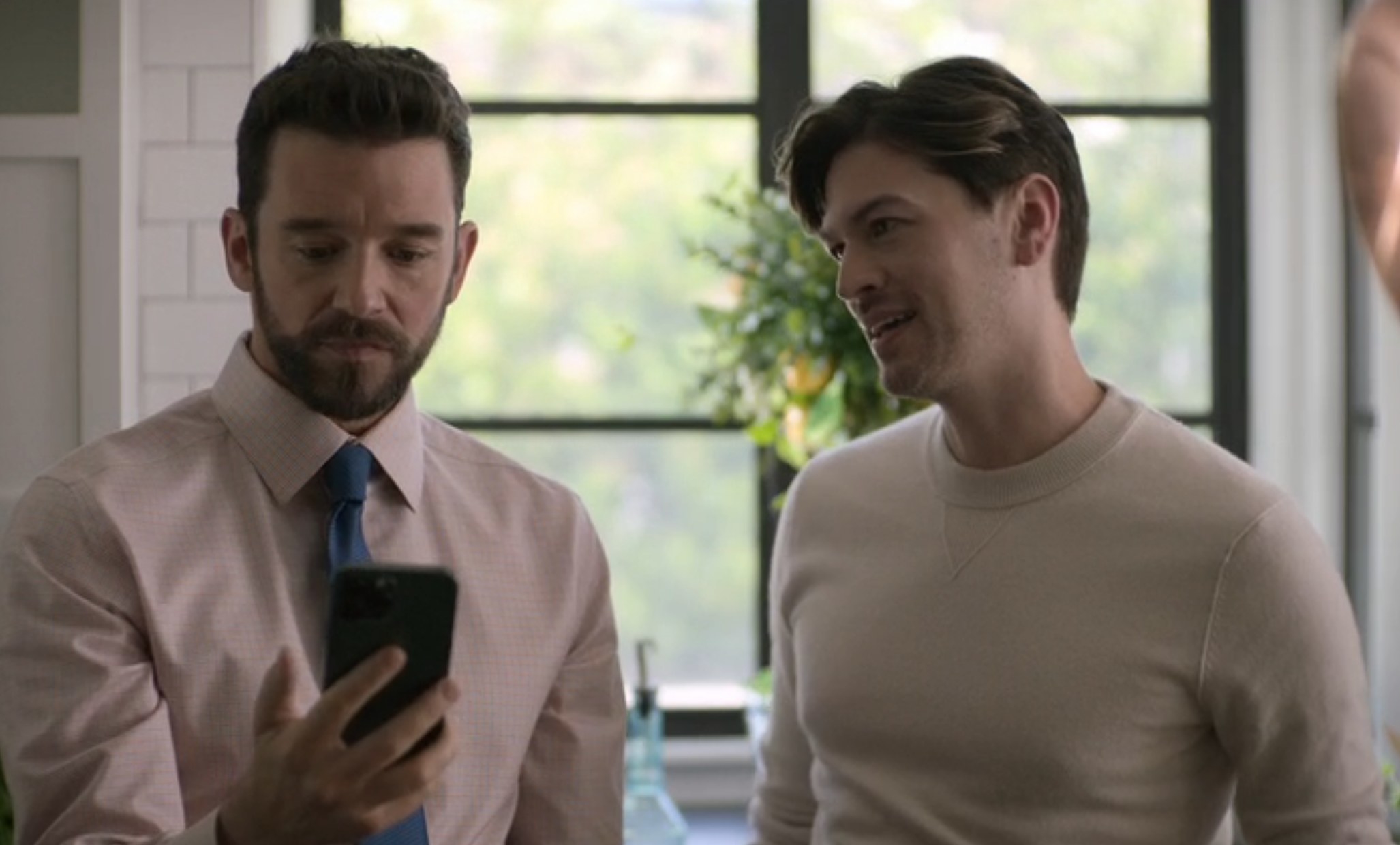 Michael Urie as Brian and Devin Kawaoka as Charlie talk in their kitchen in &quot;Shrinking&quot;