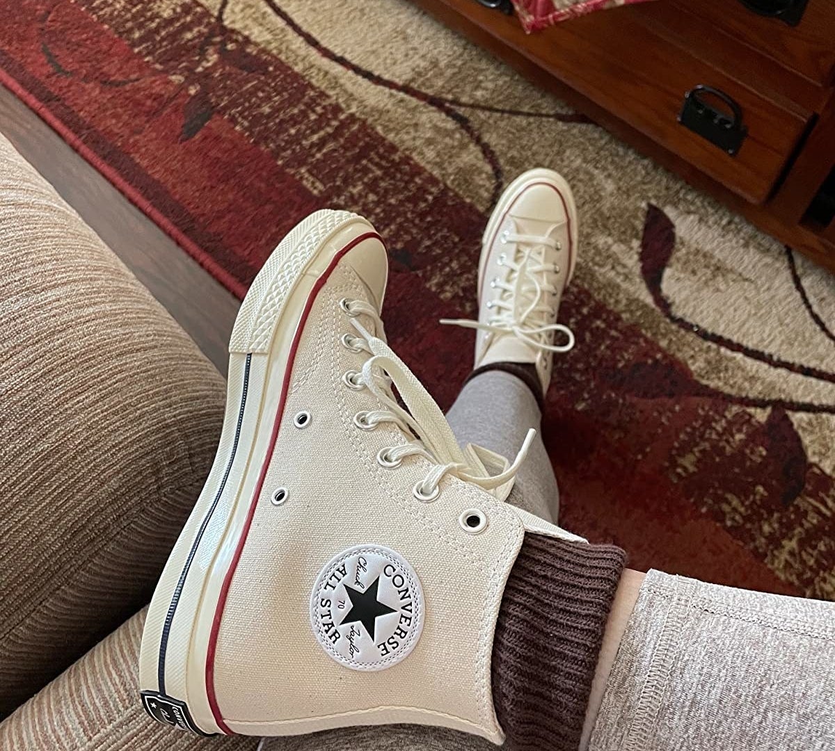 reviewer photo of offwhite high top converse sneakers