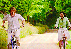 A couple riding bikes.