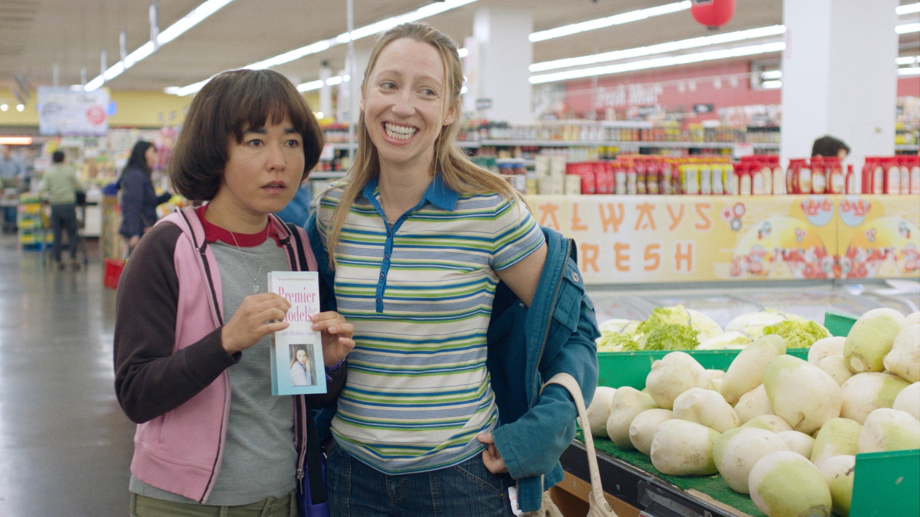 Maya Erskine and Anna Konkle stand in a grocery store