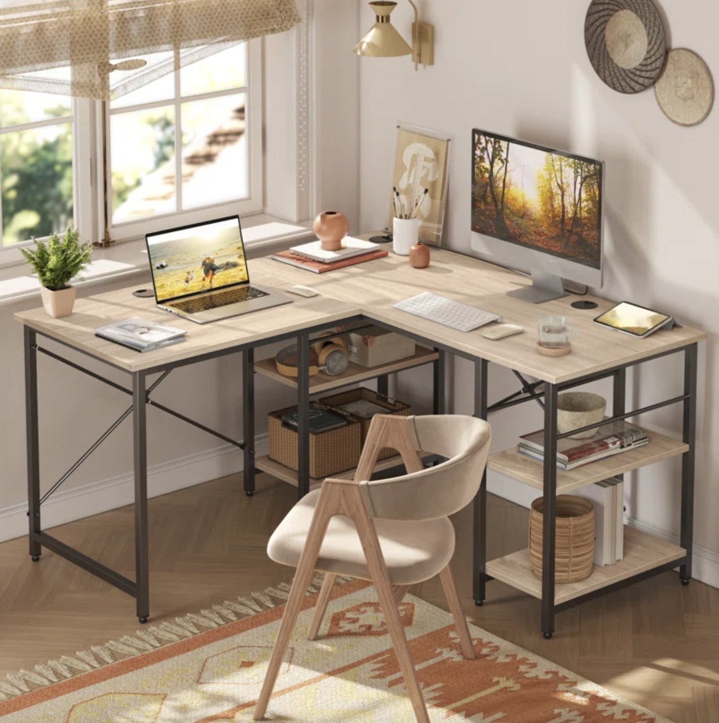 An L-shaped desk with two computers on it