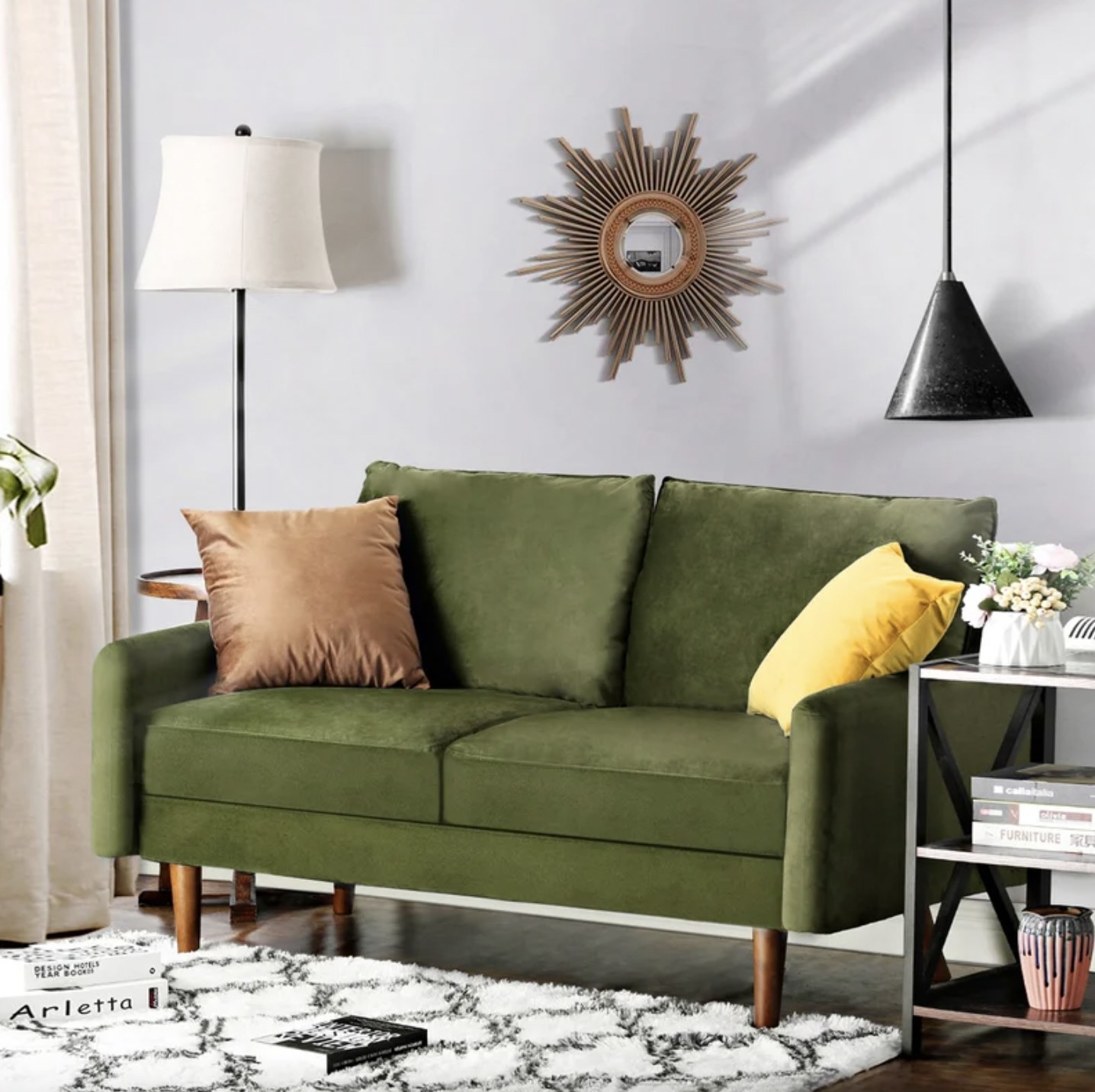 A green accent couch with a white carpet