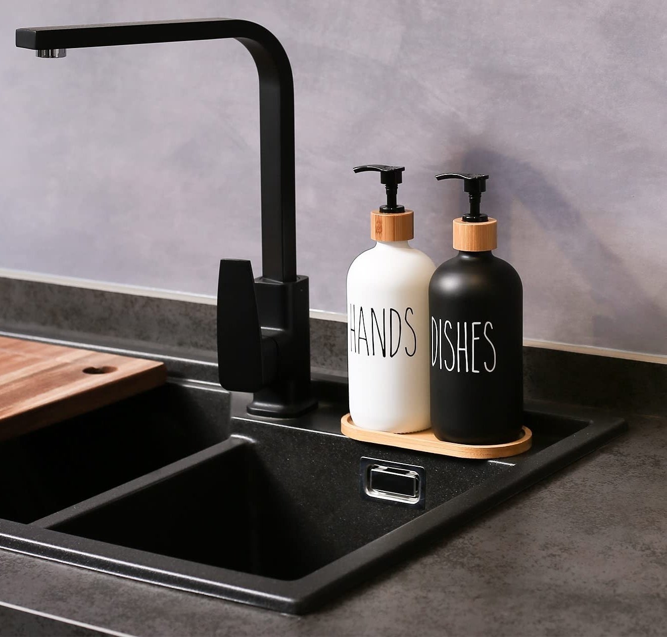 a pair of minimalist soap dispensers on a sink edge and labelled hands and dishes