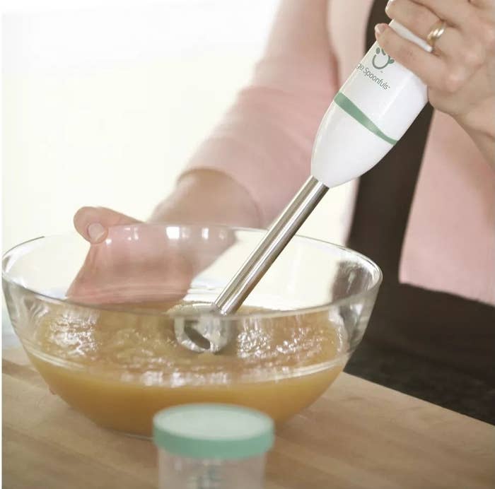 a hand using the immersion blender