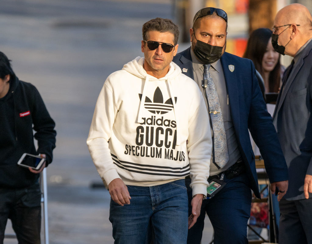 man wearing an adidas and gucci sweater