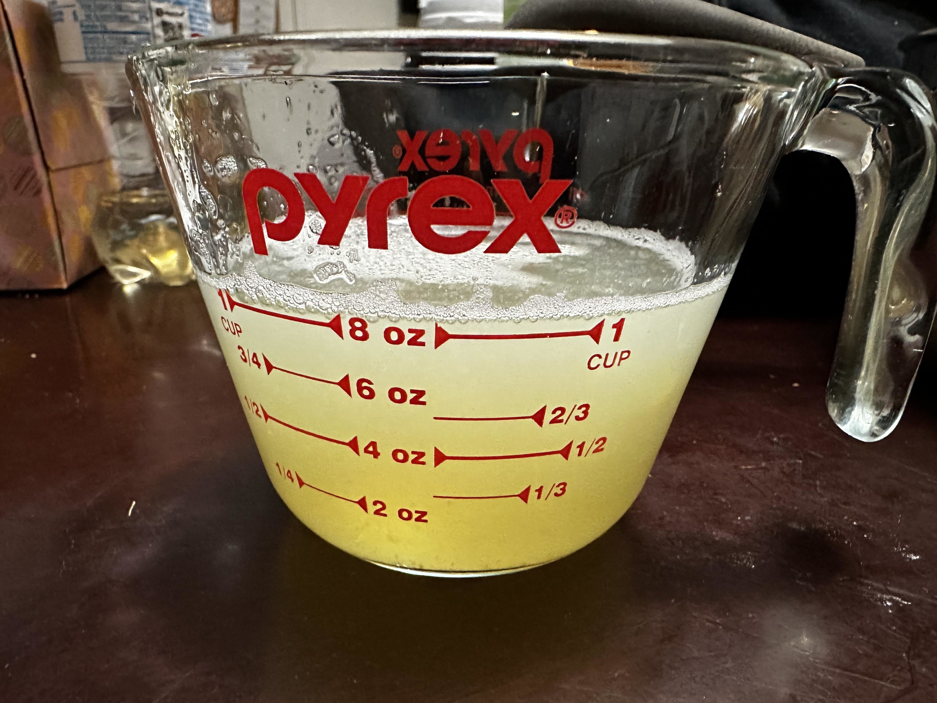 Light yellow liquid in a measuring cup