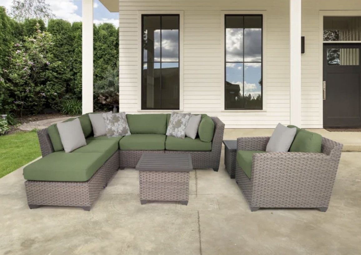 A set of outdoor furnisher with green cushions