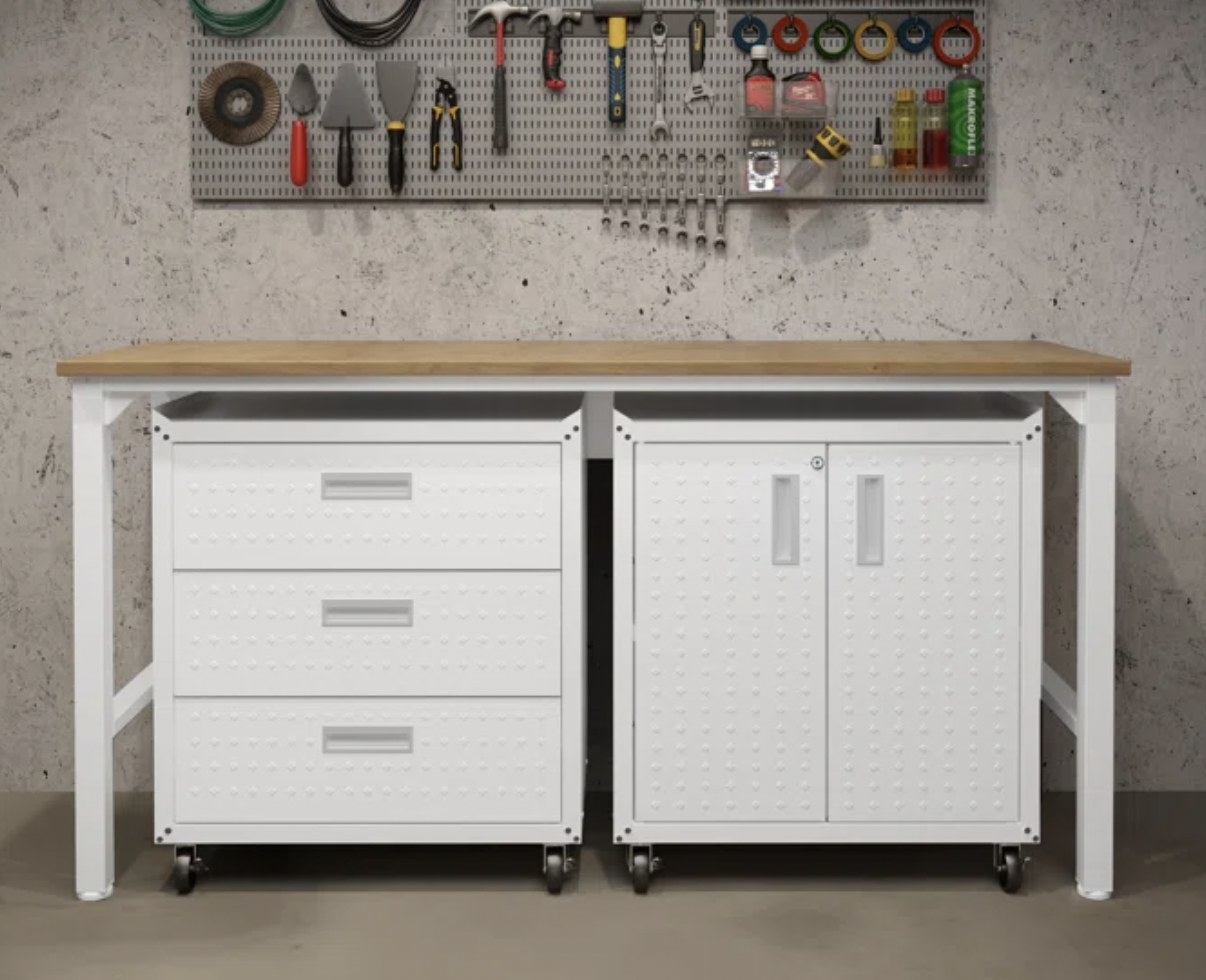 A white butcher block workbench top with tools hung about it