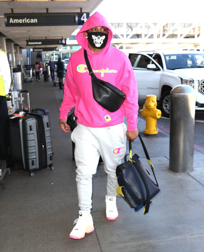 man wearing champion sweats with the logos showing