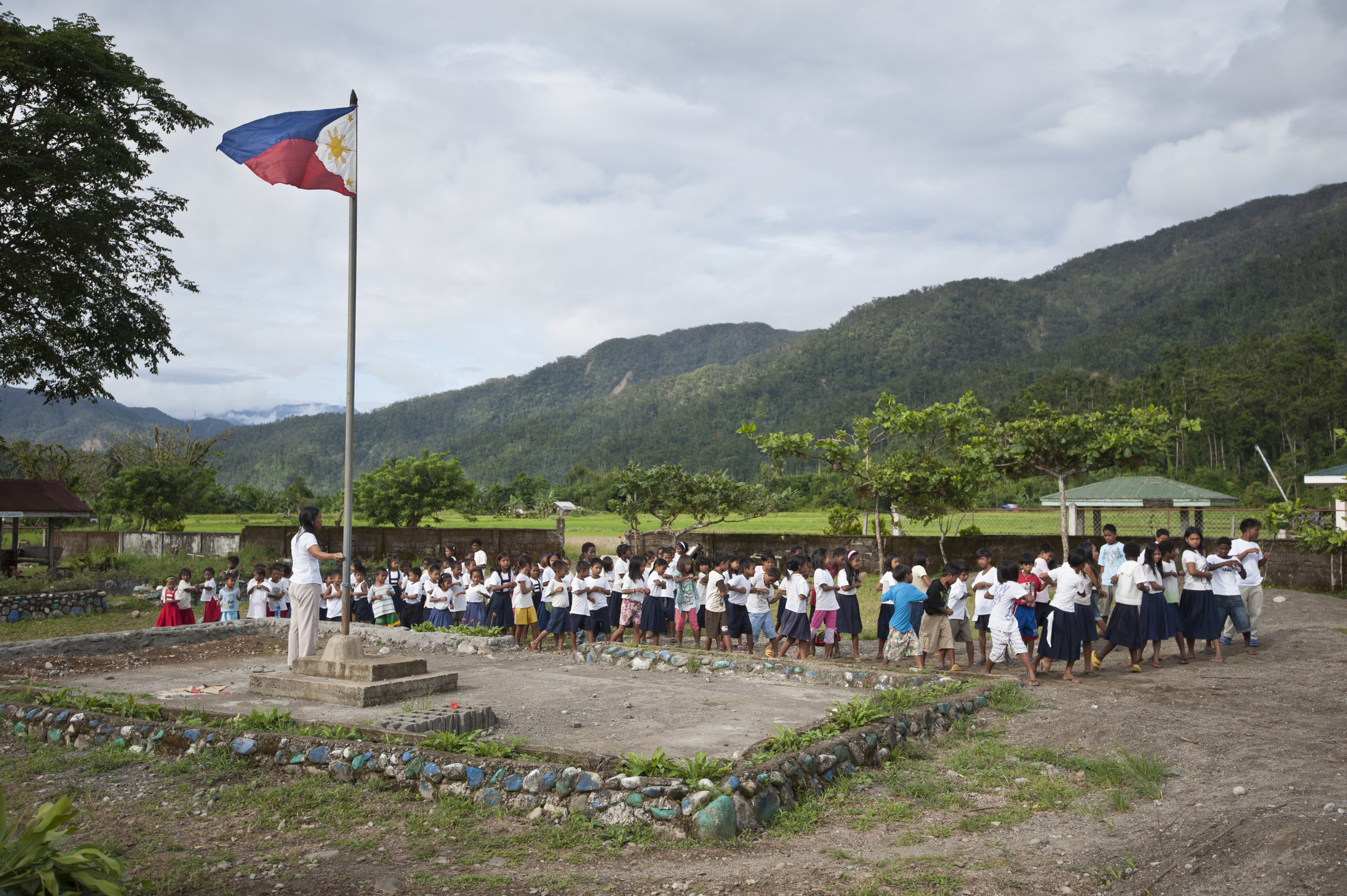 students watch Philippines flag raised