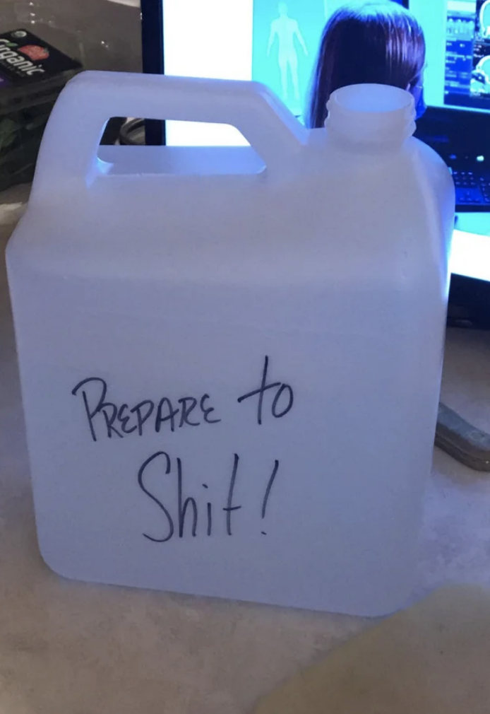 large water jug with &quot;prepare to shit&quot; written in marker