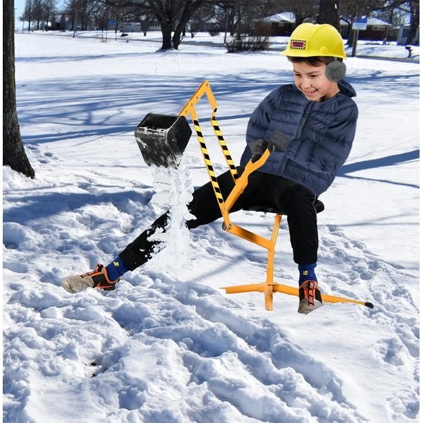 Kid digging in the snow