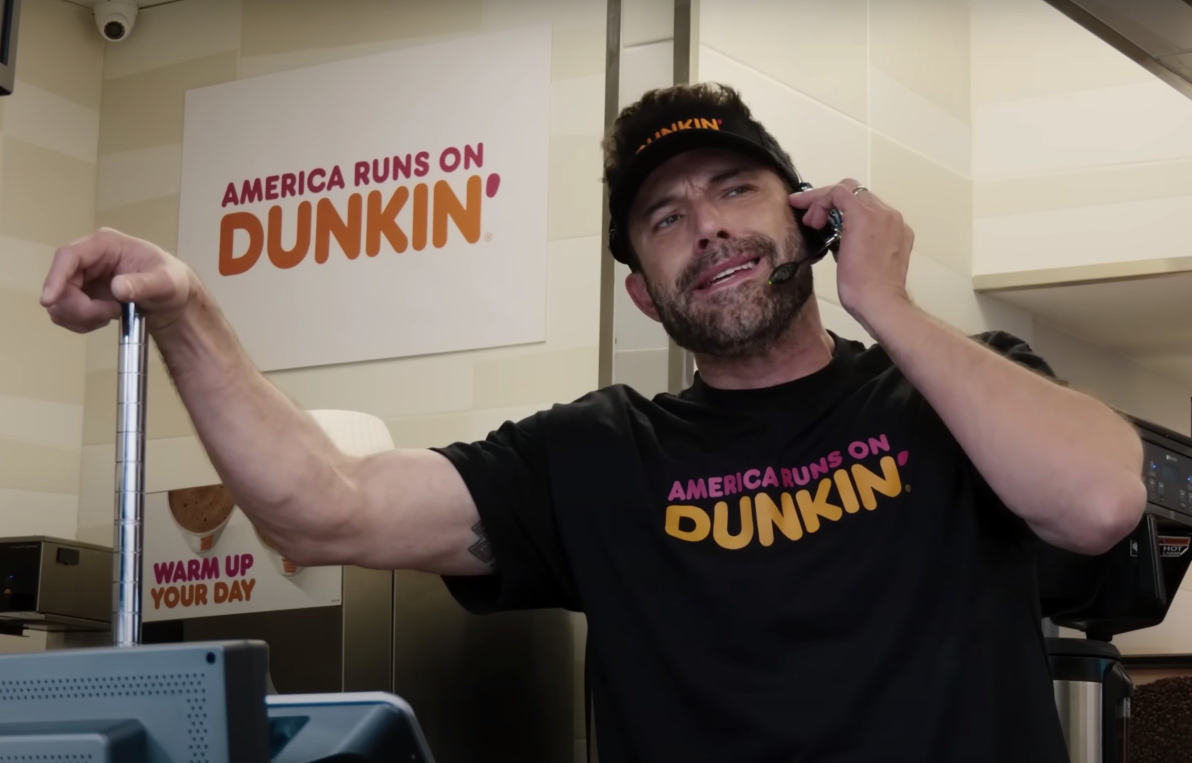 Ben takes an order inside a Dunkin