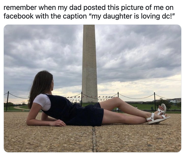 daughter laying down with the washington monument behind her in a phallic photo