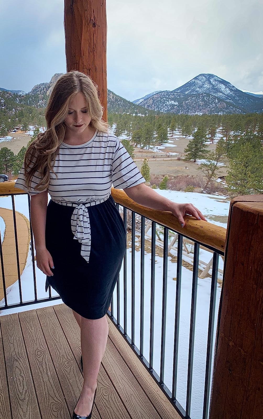 Reviewer wearing the black and white dress