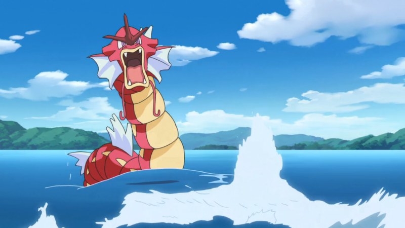 A red Gyarados thrashes in the open sea