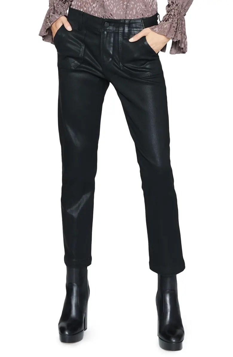 Model wearing black pants with black shoes and brown top