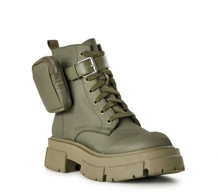 A camo green boot with a pouch on the side