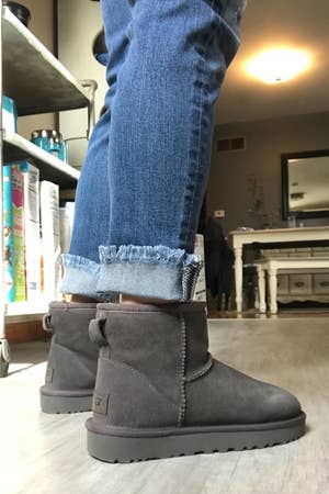 reviewer photo of gray UGG mini booties