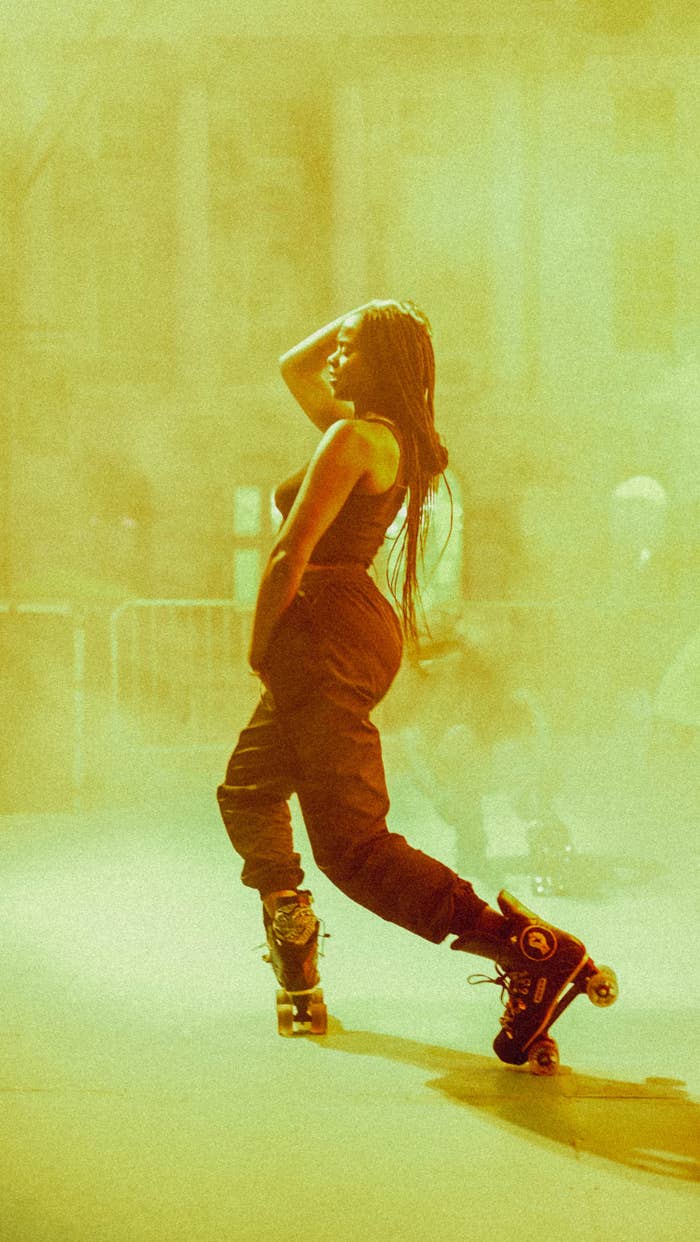 An image of a Black woman dancing in roller skates.