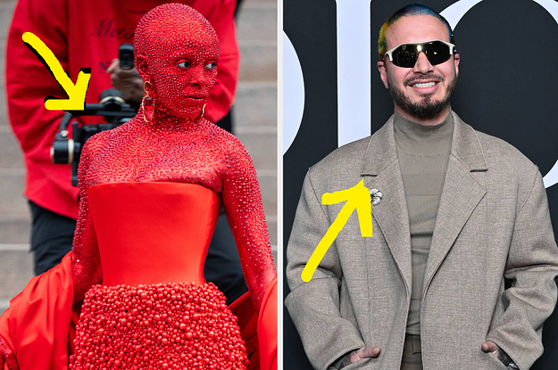 Doja Cat looks to the left while having her picture taken while J Balvin puts his hands in his pockets while posing for a photo