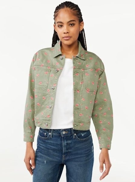 Model wearing white shirt with green denim jacket with jeans