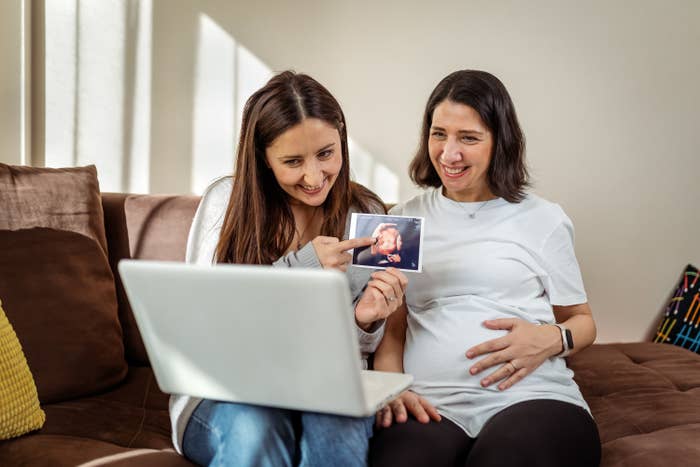 a couple showing people that they're pregnant