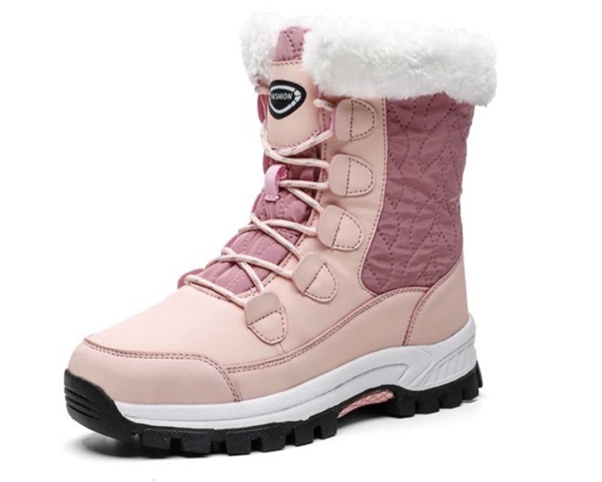 a pink snow boot with white faux fur lining