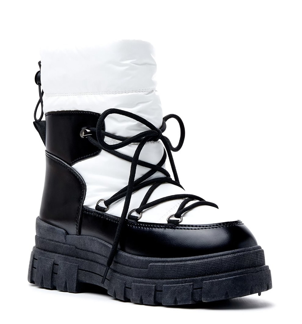 A black and white lace-up boot