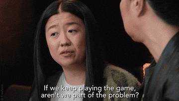 asian woman saying &quot;if we keep playing the game, aren&#x27;t we part of the problem?&quot;