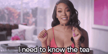 A gif of a woman saying &quot;I need to know the tea&quot;