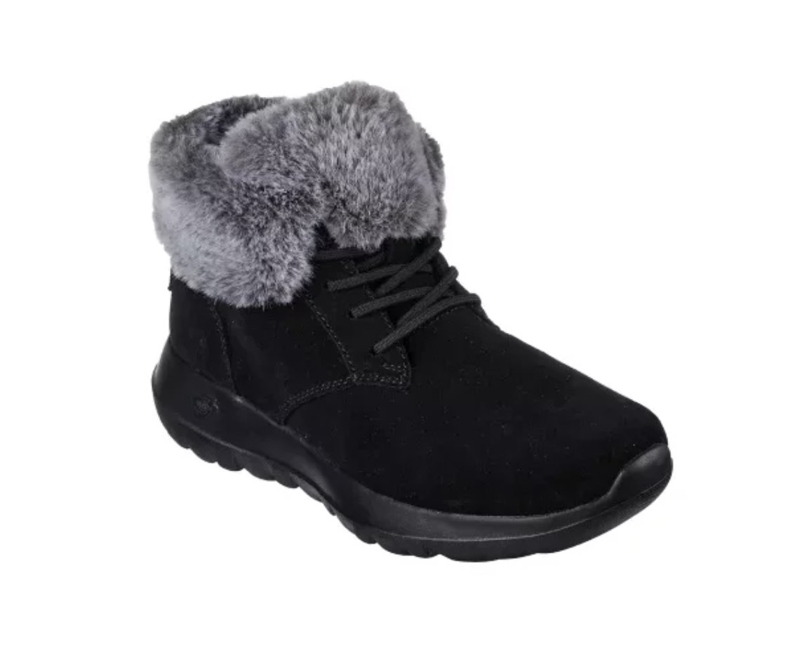 A black lace-up boot lined with grey fur