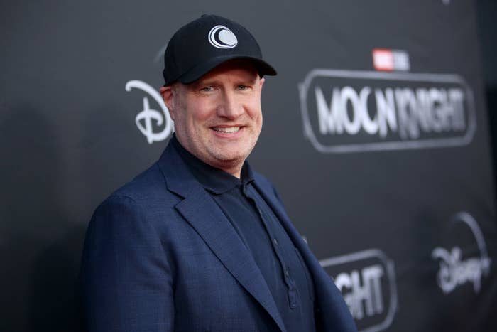 Kevin Feige smiles on the Moon Knight red carpet