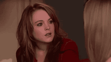 A GIF of Cady from Mean Girls nodding and smiling, looking somewhat confused