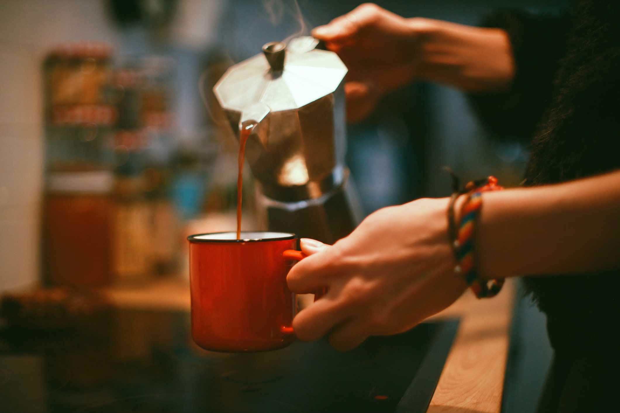 Someone pouring coffee