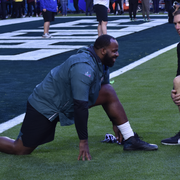 an Eagles player stretches before the game