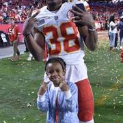 L'Jarius Sneed and his son pose for a picture